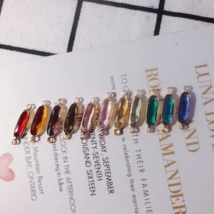 Macro shot of 11 faceted crystal pendants with gold copper trim for DIY jewelry making