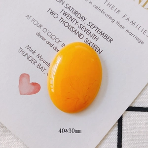 Detail of 40x30mm yellow oval resin flatback cabochon for DIY jewelry making