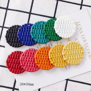 Macro view of 38mm round resin pendants with woven texture for DIY jewelry making