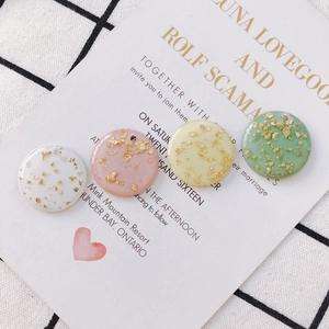 Round acrylic resin pendants with gold foil flakes in pastel colors for DIY jewelry making
