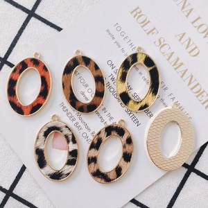 Oval alloy leopard print pendants in assorted colors for DIY jewelry making