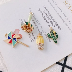 DIY colorful enamel cactus and windmill alloy charms for jewelry making on plaid background