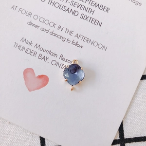 Close-up of gold-plated faceted blue crystal pendant with double loops for DIY jewelry