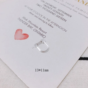 Macro shot of transparent resin U-shape spring ear clips measuring 13x11mm for DIY jewelry