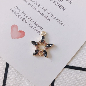 Star-shaped gold alloy jewelry connector with black marquise gems and pink rhinestones