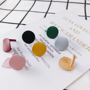 Minimalist matte geometric round stud earrings in six colors on aesthetic background