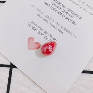 Polished red teardrop pearl pendant for DIY jewelry making on white card background