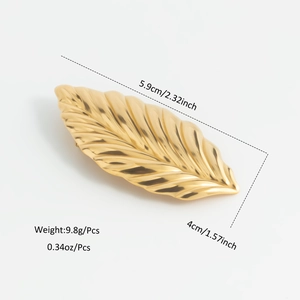 Macro view of 18K gold leaf brooch with precise length and weight measurements