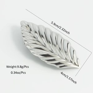 Detailed view of silver leaf brooch with 5.9cm length and fine vein textures