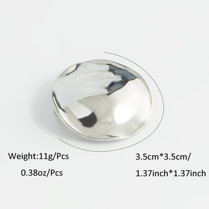 Detailed view of silver disc brooch with dimensions 3.5cm showing hammered texture
