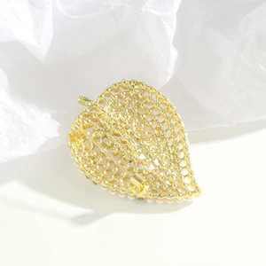 Elegant gold leaf brooch with hollow mesh design, white pearls and sparkling rhinestones