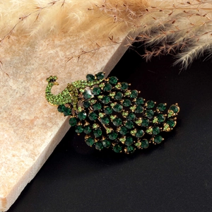 Elegant green peacock brooch with sparkling rhinestones on golden alloy base for women
