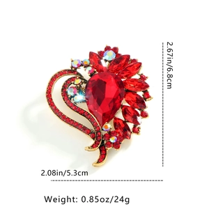 Detailed view of red heart brooch with crystal rhinestones and 6.8cm size markings