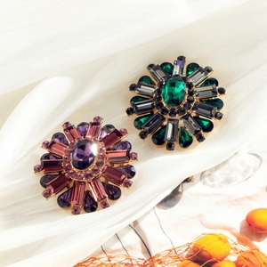 Elegant floral flower brooch set with purple and green rhinestones in luxury metal finish