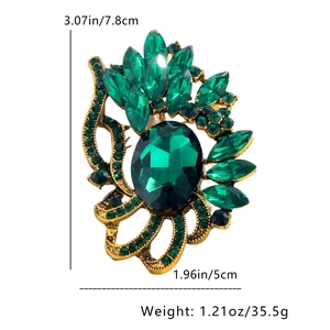 Detailed dimensions of hollow vintage brooch with emerald crystals and gold metal