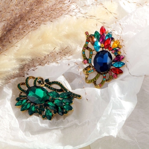 Vintage hollow gemstone brooch set with colorful rhinestones in a luxury court style design