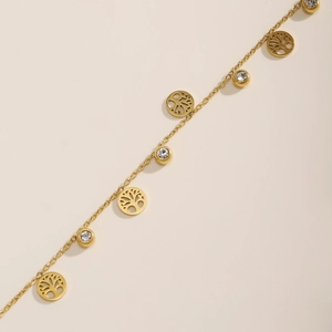 Gold tree of life anklet with sparkling white zircon crystals on a minimalist chain