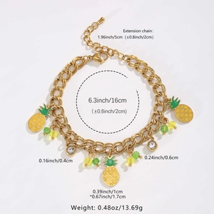 Detailed view of golden bracelet dimensions with pineapple and crystal charms