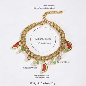 Detail of gold grapefruit charm bracelet with beads and crystal settings on white backdrop