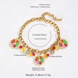 Detail view of golden fruit bracelet showing precise measurements of charms and chain length
