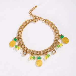 Golden double-layer bracelet with pineapple charms and sparkling stone settings