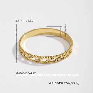 Gold star-shaped hollow bangle with white crystals and dimension markings
