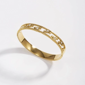 Elegant gold-plated stainless steel hollow star bangle with white zircon insets