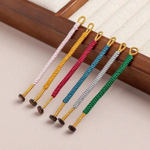 Handmade woven knotted pendants in six vibrant colors with golden metal ring detail