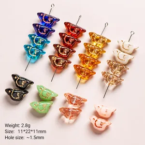 Czech glass bird beads for jewelry making with double-sided gold outline and vibrant colors