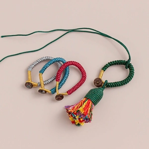 Handcrafted Vajra knot braided cord charms in assorted colors with wooden rings