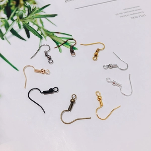 Macro view of multi-color DIY earring hooks with spring and bead detail on card