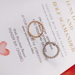 Close-up of gold and silver pave rhinestone circle charms for DIY jewelry making