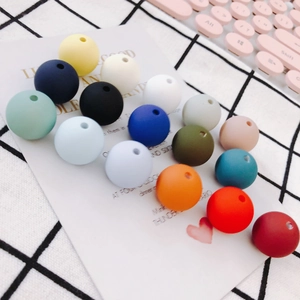 Close-up of matte silicone round beads in 16 colors for DIY jewelry making and crafts