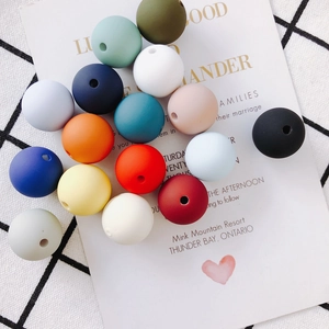 Detailed macro view of colorful matte round beads for DIY necklaces and handmade jewelry