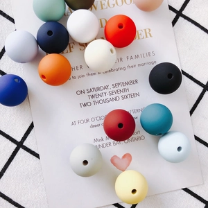 Macro shot of colorful matte silicone beads for DIY handmade jewelry crafting