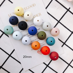 Top view of colorful 20mm matte silicone beads with holes for DIY jewelry making