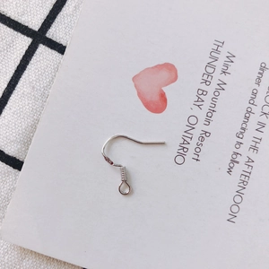 Detailed close-up of S925 sterling silver ear hooks with authentic hallmark stamp