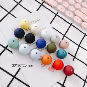 Macro view of 20mm colorful matte silicone round beads for DIY earring and jewelry making