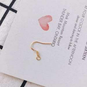 Detailed view of an S925 stamped gold-plated earring hook for DIY jewelry making