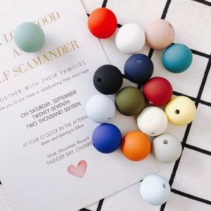 Close-up of multi-colored matte silicone round beads for DIY jewelry and crafts making