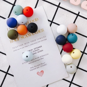 Macro detail of matte colorful silicone beads with holes for DIY jewelry making and crafts