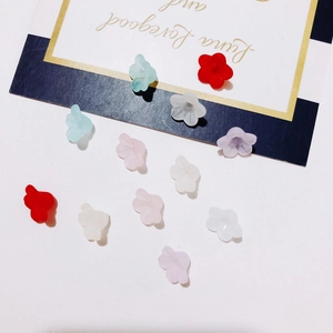 Macro detail of colorful candy-colored resin flower beads for DIY jewelry making