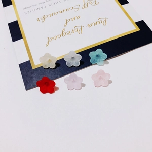 Macro view of colorful resin flower beads for DIY jewelry and handmade accessories