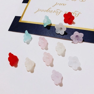 Macro detail of matte pastel resin flower beads for DIY jewelry and earring making