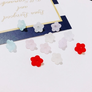 Macro view of multi-color frosted resin flower pendants for DIY jewelry making crafts