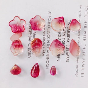 Detailed view of DIY translucent pink flower and leaf resin beads with gold glitter