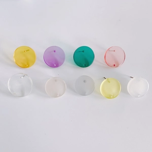 Flat round acrylic earring studs in multi-color set with metal posts on white background