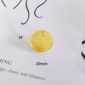 Detailed view of 20mm translucent yellow resin round charm for DIY jewelry earrings