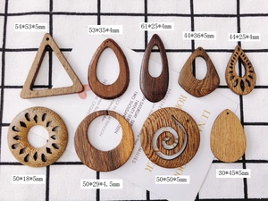 Assorted DIY wooden earring charms in geometric shapes with natural wood grain patterns