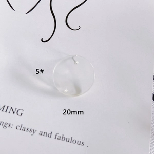 Detailed view of a 20mm clear round acrylic DIY charm for earring and jewelry making